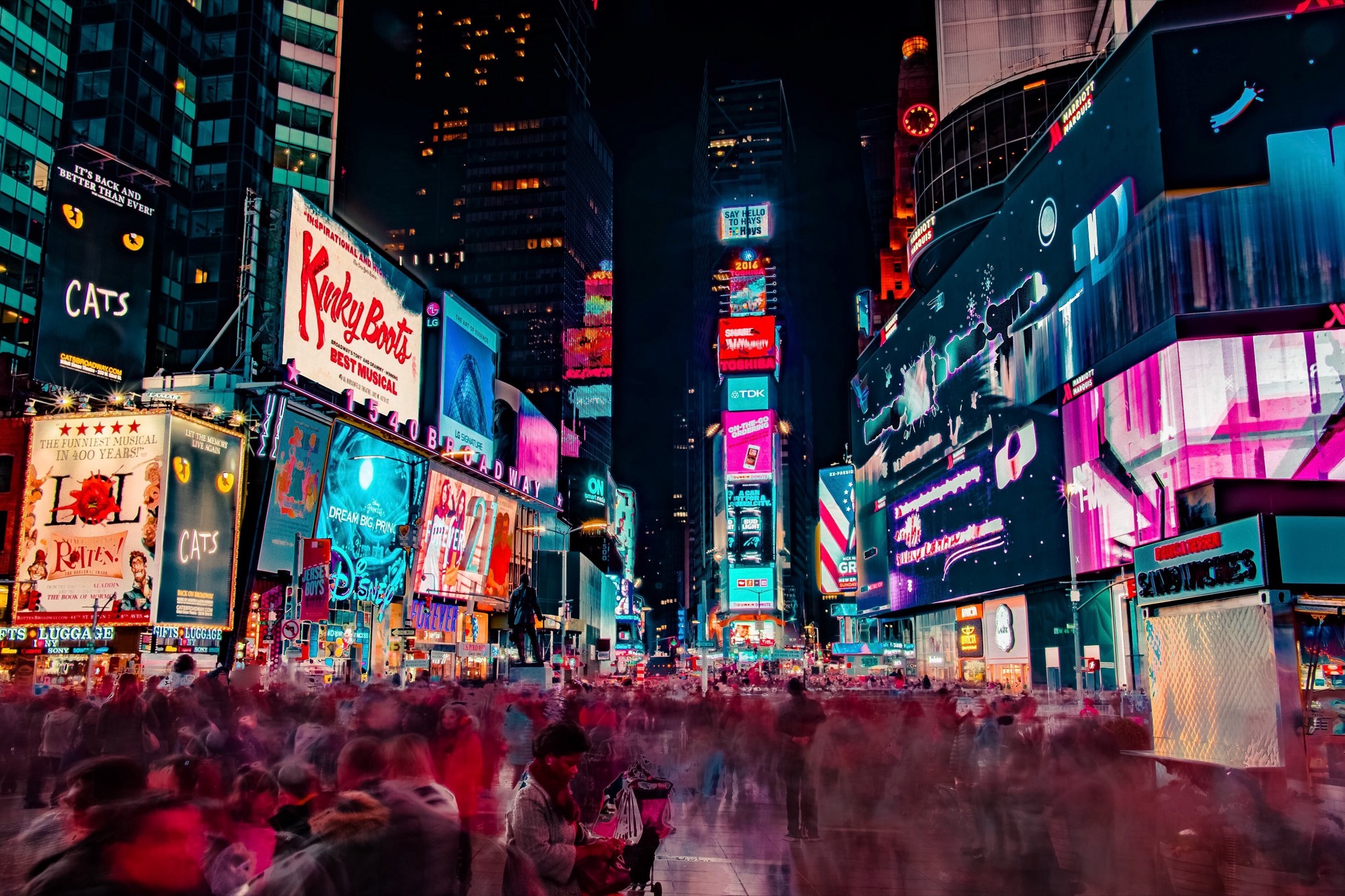 Broadway marquees lighting up Times Square at night